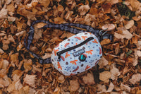 Thumbnail for TopDog Harnesses Matching Essential Dog Walking bag on an autumn leaf covered ground